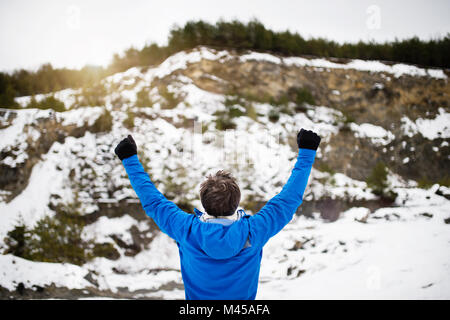 Senior man jogging in winter nature. Stock Photo