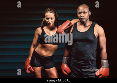 Composite image of portrait of confident boxers Stock Photo