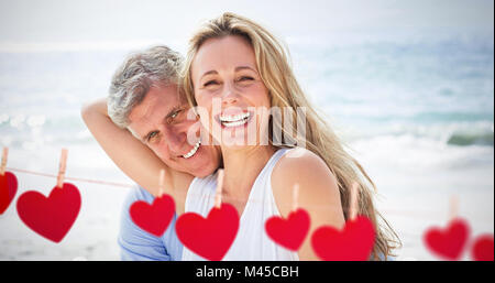 Composite image of happy couple laughing together Stock Photo