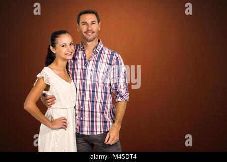 Composite image of portrait of young couple standing Stock Photo