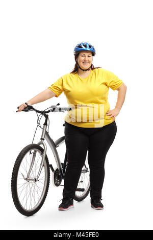Full length portrait of an overweight woman with a bicycle isolated on white background Stock Photo