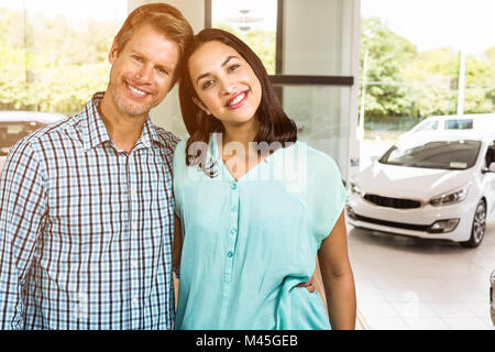 Composite image of portrait of happy couple standing Stock Photo