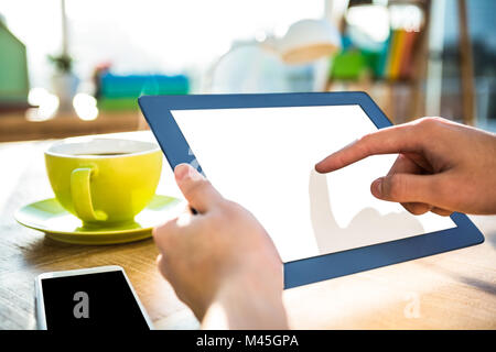Cropped image of hipster businessman using tablet Stock Photo