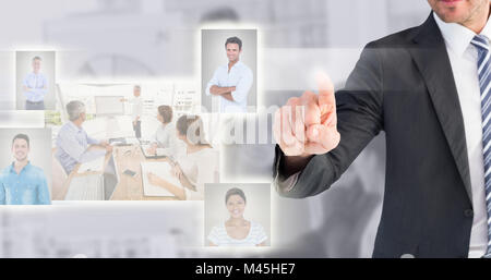 Composite image of businessman pointing with his finger Stock Photo