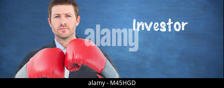 Composite image of businessman with boxing gloves Stock Photo