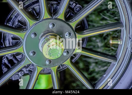 Close up of a brass tire wheel from a 1911 Pierce Arrow vintage automobile. Stock Photo