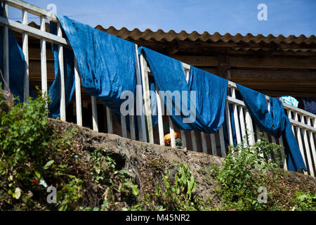 Indigo fabric drying on balcony in Cat Cat Village in the valley of Sapa Vietnam Stock Photo