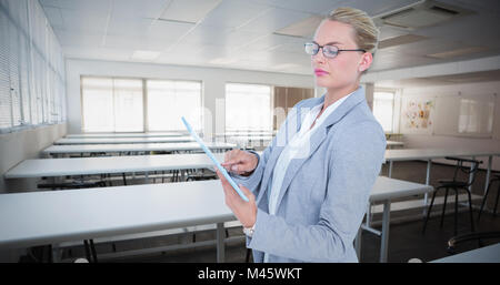 Composite image of businesswoman using digital tablet Stock Photo