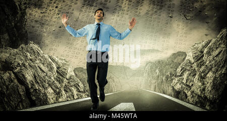 Composite image of happy businessman running with hands up Stock Photo