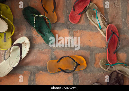 Tradition to remove your shoes when going indoors in Mandalay Myanmar Stock Photo