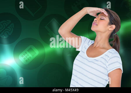 Composite image of upset woman suffering from headache Stock Photo