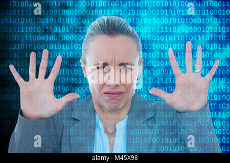 Composite image of upset businesswoman showing her hands Stock Photo
