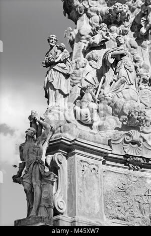 Kremnica  - The Safarikovo square and detail of the baroque Holy Trinity column with the St. Sebastian and St. Joseph by Dionyz Ignac Stanetti Stock Photo