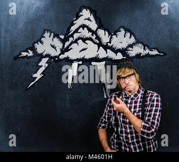 Composite image of serious blond hipster smoking a pipe Stock Photo