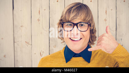 Composite image of portrait of hipster making phone sign Stock Photo