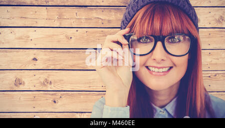 Composite image of smiling hipster woman looking at camera Stock Photo