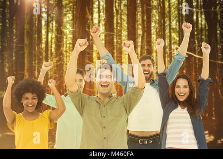 Composite image of young creative business people gesturing arm up Stock Photo
