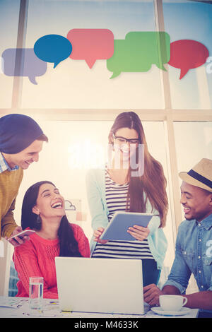 Composite image of young creative team having a meeting Stock Photo