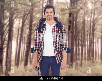 Composite image of portrait of happy man standing Stock Photo