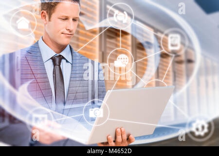 Composite image of businessman holding his laptop Stock Photo