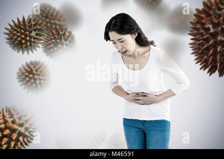 Composite image of young woman with stomach pain