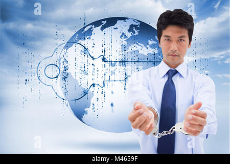 Composite image of portrait of a businessman with handcuffs Stock Photo