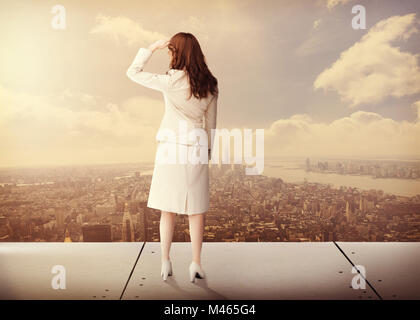 Composite image of rear view of businesswoman Stock Photo