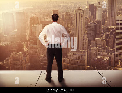 Composite image of rear view of classy young businessman posing Stock Photo