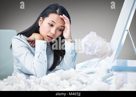 Composite image of unsmiling businesswoman with hands on face Stock Photo