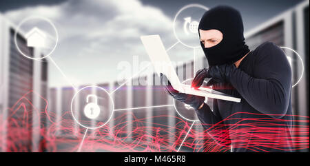 Composite image of hacker using laptop to steal identity Stock Photo