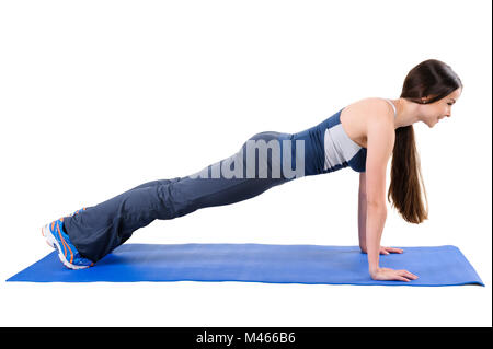 Young woman doing Straight Arms Plank Workout Stock Photo