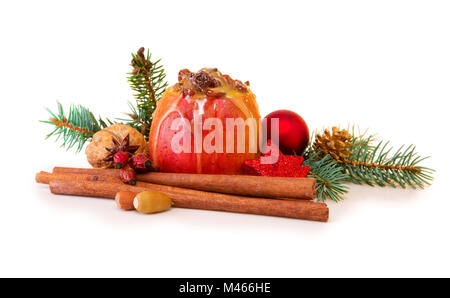 Baked apple with Christmas decoration isolated. Stock Photo