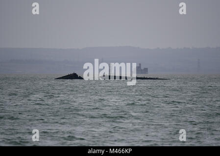 D-Day section of Mulberry Harbour or Harbor grounded in the Thames Estuary near Southend on Sea, Essex, with Grain Tower mouth of River Medway beyond Stock Photo