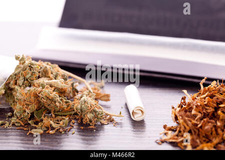 Dried Cannabis on Rolling Paper with Filter Stock Photo