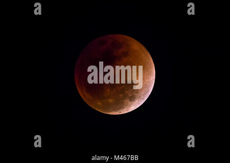Blood Moon in the lunar eclipse and also a Blue Moon and super moon isolated on black background Stock Photo