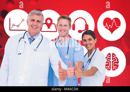 Composite image of portrait of smiling doctors with thumbs up Stock Photo
