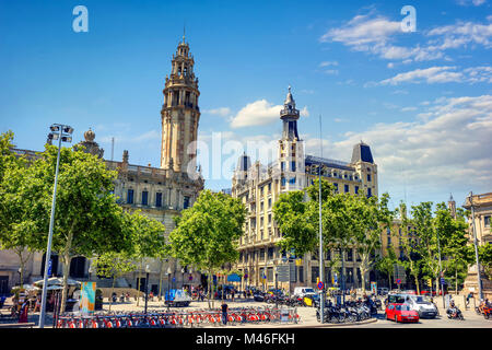Cityscape with historic architectural attractions and transport traffic in downtown. Barcelona, Catalonia, Spain Stock Photo