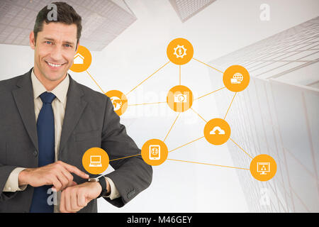 Composite image of businessman showing his watch Stock Photo