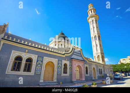 Facade and tall minaret tower of mosque in Nabeul. Tunisia, North Africa Stock Photo