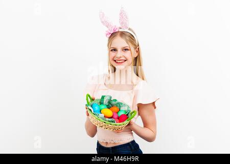 Teenage girl holding Easter eggs Stock Photo
