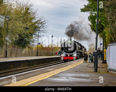 The cathedrals express passes throuch Charing train station, Kentm UK pulled by the Oliver Cromwell locomotive 70013 Stock Photo