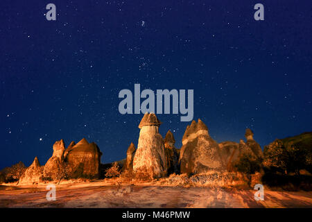 Fairy chimneys at night with stars in the sky, Cappadocia, Turkey Stock Photo