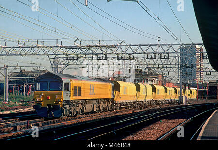 An ARC owned class 59 diesel locomotive number 59104 'Village of Great Elm' hauling a rake of empty ARC JHA hopper wagons at Stratford. 4th October 1993. Stock Photo