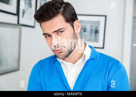 Young man patient waiting psychology session thinking close-up Stock Photo
