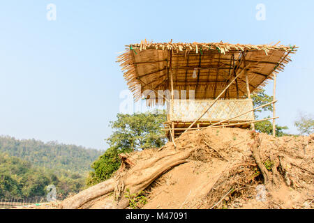 photo of bamboo hut on the mound Stock Photo