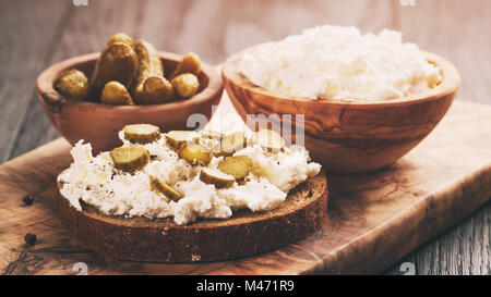 sandwiches with rye bread, cream cheese and marinated cucumbers Stock Photo