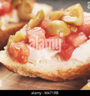 crostini with tomato, mozzarella and olives Stock Photo