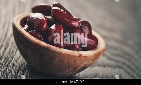 red beans from can in wood bowl Stock Photo