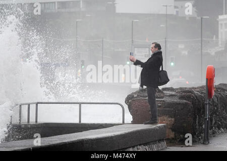 Torbay Road, Torquay. 14th February 2018. Heavy rainfall and strong winds across the West Country today. Large waves hitting the seafront in Torquay, South Devon. Credit: james jagger/Alamy Live News Stock Photo