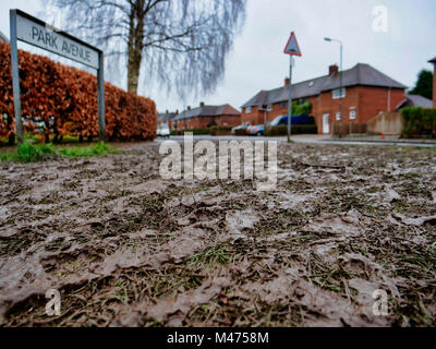 Ashbourne, UK. 14th Febraury, 2018. Mud everywhere at the end of the two day Ashbourne Royal Shrovetide hugball Football match Shrove Ash Wednesday 14th February 2018. Ye Olde & Ancient Medieval hugball game is the forerunner to football. It's played between two teams, the Up'Ards & Down'Ards separated by the Henmore Brook river. Credit: Doug Blane/Alamy Live News Stock Photo